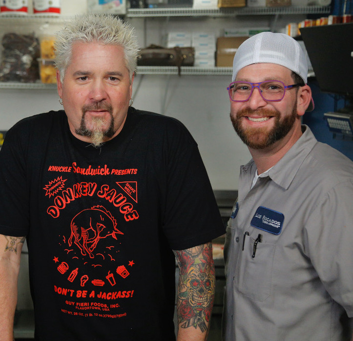 Host Guy Fieri Posing with Chefs and Co-Founders Robby Bushman and Anthony Hoff in the kitchen at Los Bocados in Parkland, Florida as seen on Food Network's Diners, Drive-Ins and Dives episode DV3213H.