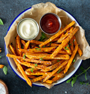 Sweet potato fries with mayo and ketchup, homemade roasted in the oven